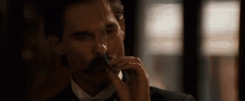 Tombstone Kurt Rusell Smoking GIF