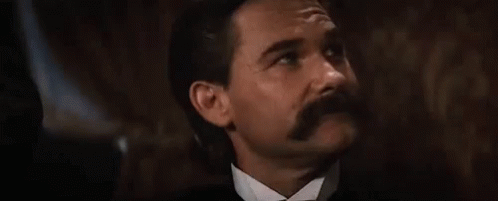 Tombstone Johnny Ringo Playing GIF