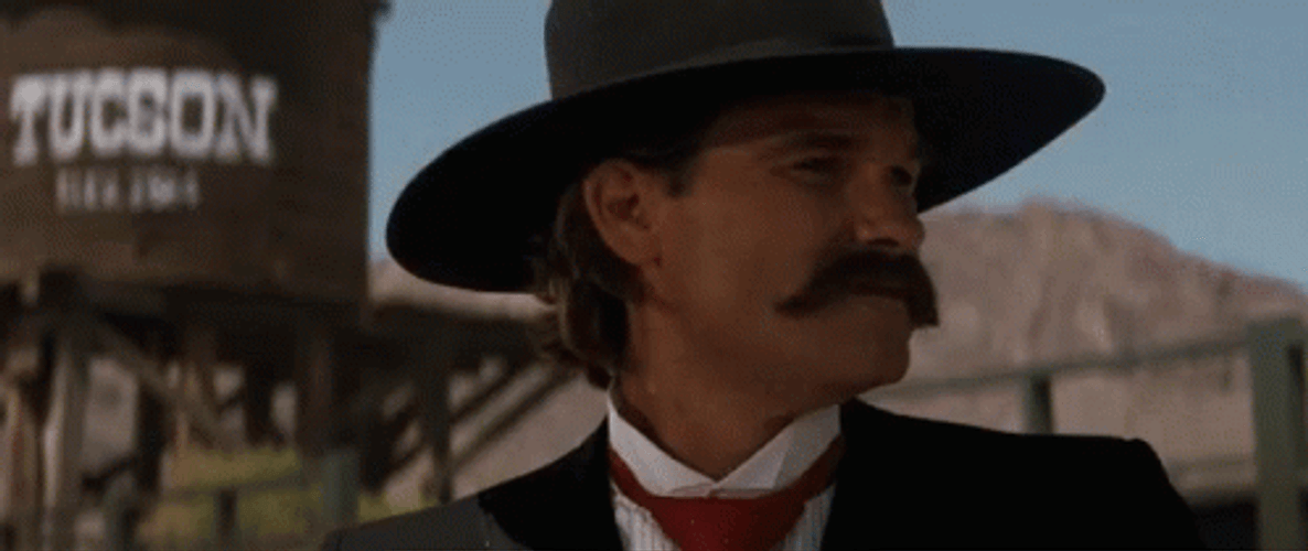 Tombstone Kurt Russel Laughing Hard GIF