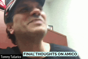 Tommy Tallarico Is Wearing A Black Shirt And A Hat GIF