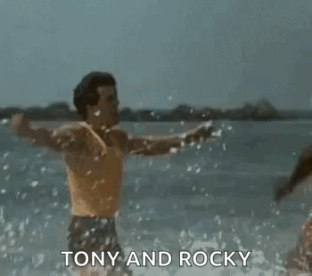 Tony and Rocky Men Arms Outstretched in Water