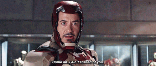 Tony Stark Is Wearing A Helmet And Saying Come On I Ain 'T Scared Of You . GIF