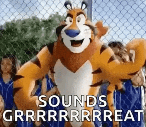 Tony the Tiger Standing in Front of Chain Link Fence With People Behind