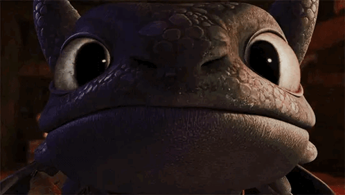 Toothless From How To Train Your Dragon Is Looking At The Camera With A Big Smile On His Face . GIF