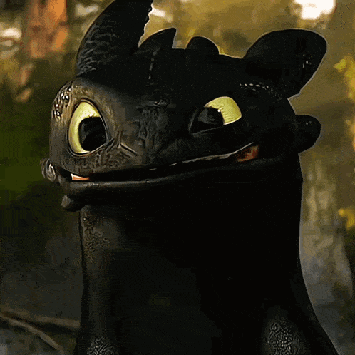 Toothless From How To Train Your Dragon Is Smiling With His Mouth Open GIF