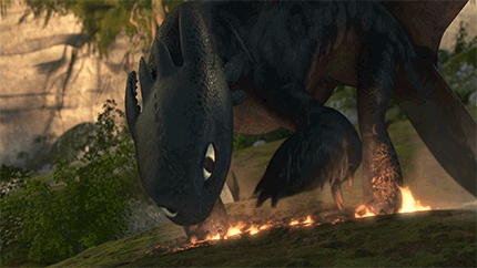 Toothless Laying Down On Fire GIF