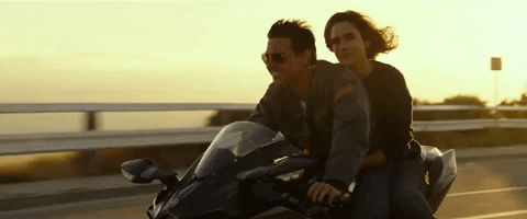 Top Gun Maverick And Girlfriend Riding Motorcycle GIF