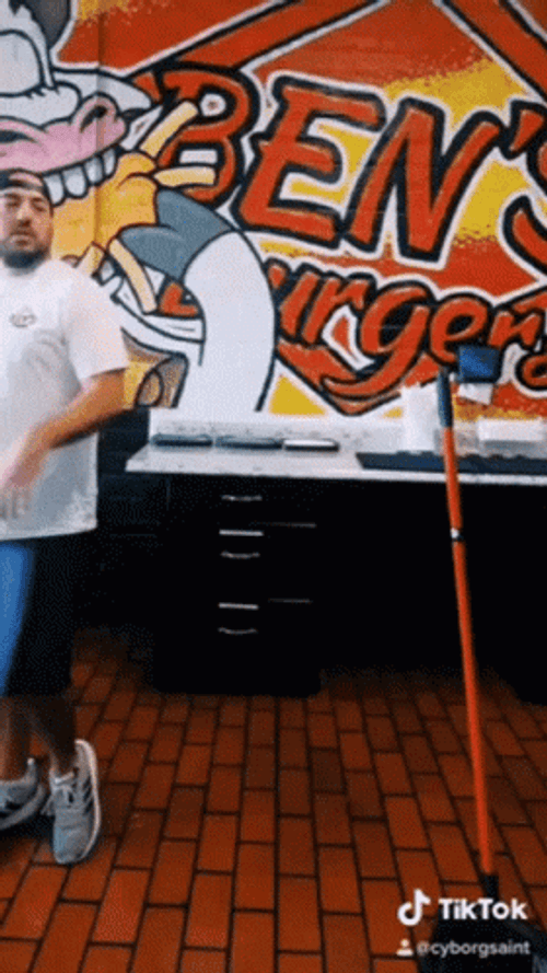 Torn Between To Sweep The Floor Or Not GIF