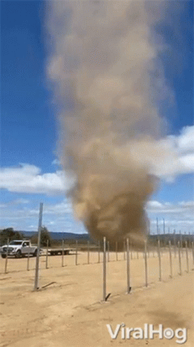 Tornado Coming Out of Ground With Truck in Background