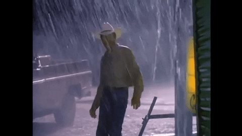 Tornado Wrangler Cowboy Soaking In Rain GIF