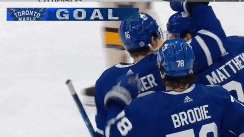 Toronto Maple Hockey Players Celebrate Goal With Banner GIF