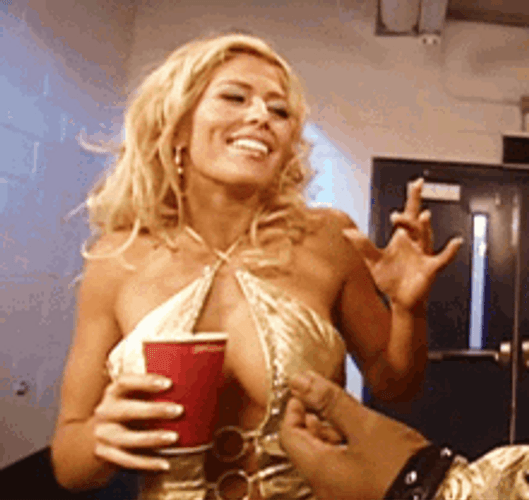 Torrie Wilson Laughing With Drinks In Hand GIF