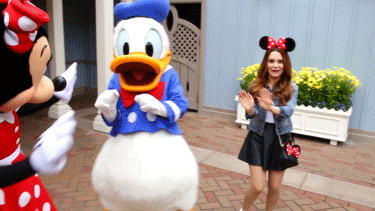 Tourist Happily Dancing With Donald Duck In Disneyland GIF