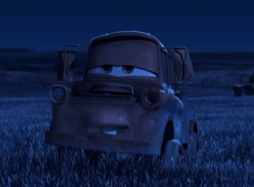 Tow Truck From Cars Sitting In Grass At Night GIF