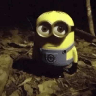 Toy Minion Sitting in Darkness