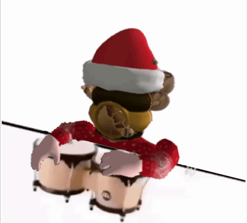 Toy Monkey in Santa Hat Playing Drums