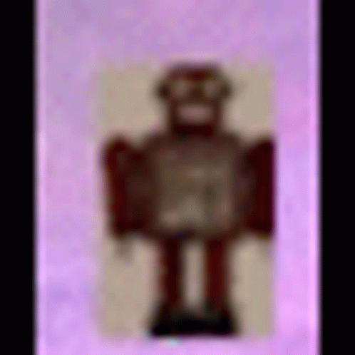Toy Robot on Pink Background