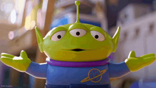 Toy Story Alien With Purple Shirt And Arms Outstretched GIF