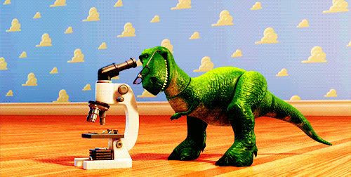Toy Story Rex Looking On A Microscope GIF