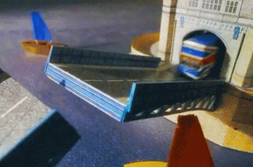 Toy Truck Driving Through Tunnel Under Tower
