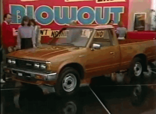 Toyota Truck in Front of Blowout Sign