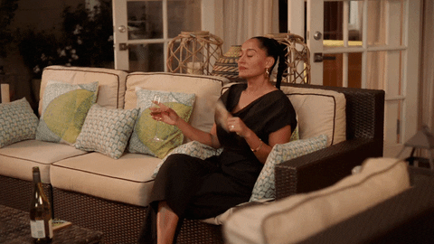 Tracee Ellis Ross Drinking Wine Feeling Hot GIF