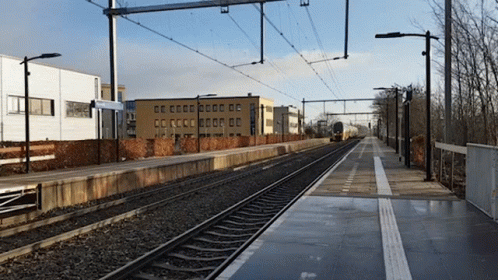 Train Track With Building and CC Sign
