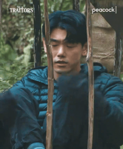 Traitors Ad Man Laying In Woods GIF