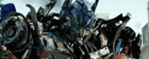 Transformer Standing in Front of Blurry City