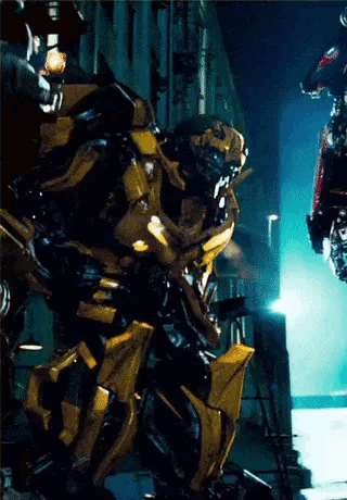 Transformer Standing in Front of Building at Night