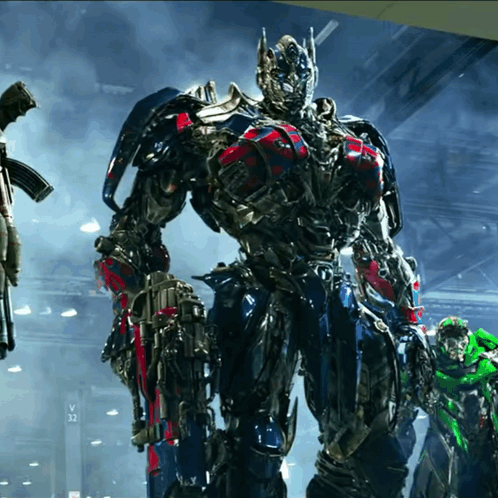 Transformer Standing in Front of Sign Saying V32