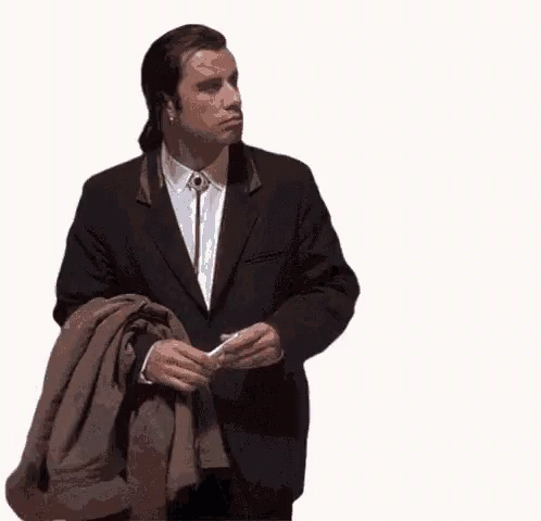 John Travolta Holding Sweater GIF