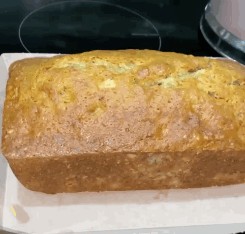 Tray Of Food In Oven With Number 52 GIF
