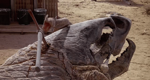 Tremors Graboid Tongue Removing Axe GIF