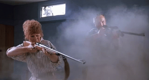Tremors Heather And Burt Gummer Firing On Graboids GIF