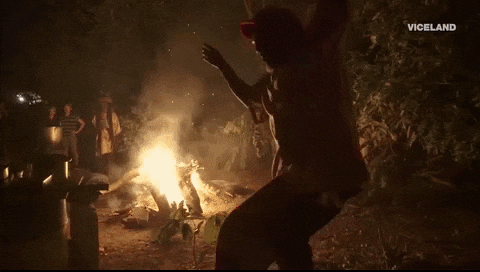 Tribal Chief Dancing Through Bon Fire GIF