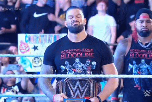 Tribal Chief Roman Holding And Looking His Belt GIF