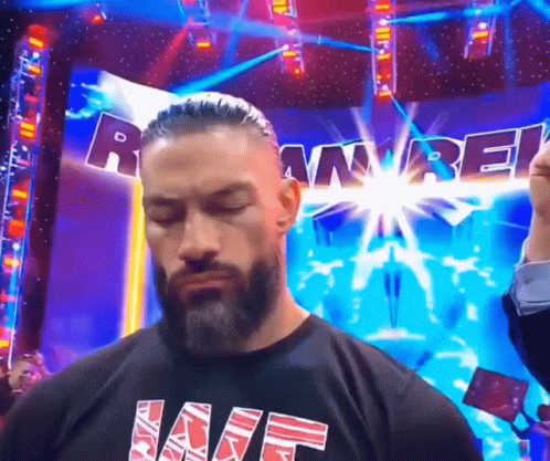 Tribal Chief Roman Reigns Closing Eyes And Smirks GIF