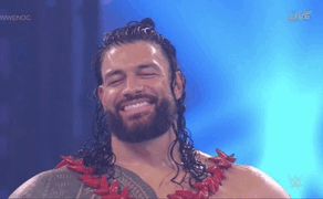 Tribal Chief Roman Reigns Smiling While Closing Eyes GIF
