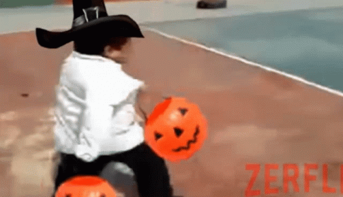 Trick Or Treat Kid Walking With Two Pumpkin Baskets GIF