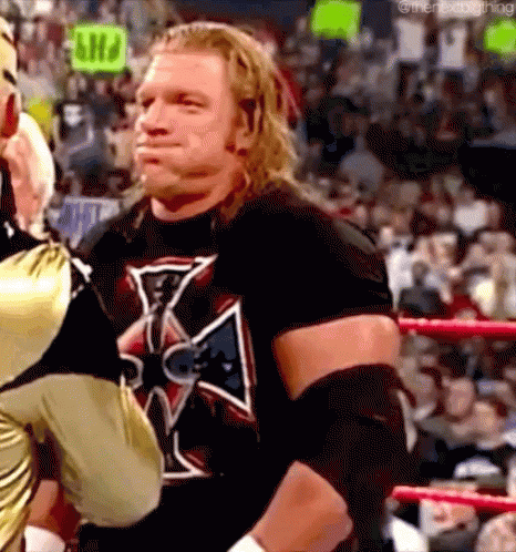 Triple H Controlling Laughter In Mockery GIF