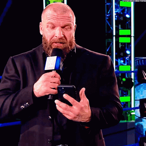 Triple H Reading Text Disappointed Reaction GIF