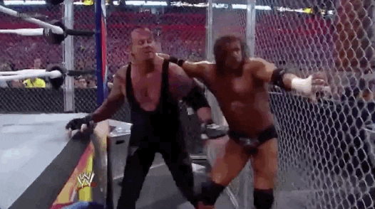 Triple H Slamming Opponent On Cage GIF