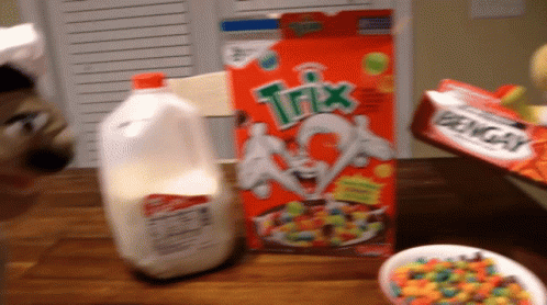 Trix Cereal Box Next to Gallon of Milk