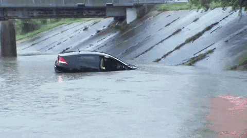 Tropical Storm Vehicle Engulfed By Flood GIF