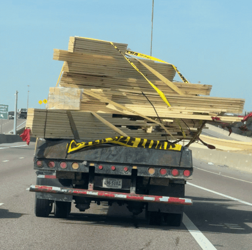 Truck Carrying Stack of Wood With License Plate BC-510A