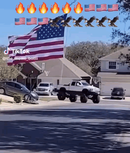 Truck Driving Past American Flag