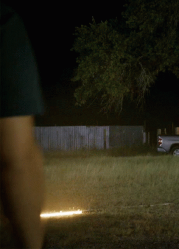 Truck Parked in Field at Night