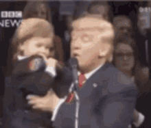 Trump Holding A Child On Inauguration Day GIF