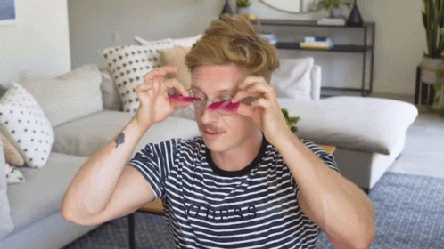 Try To Put On Fake Pink Long Eyelashes GIF